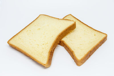 High angle view of bread on white background