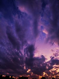 Low angle view of dramatic sky at night