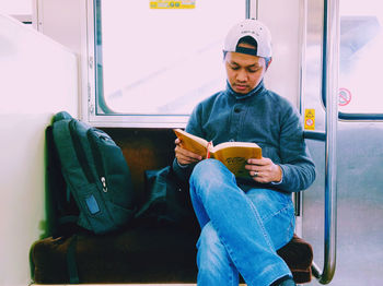 Man sitting in train