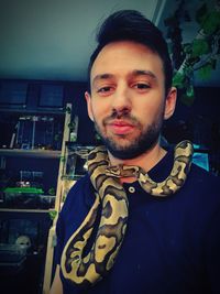 Portrait of young man at home