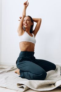 Young woman doing yoga at home