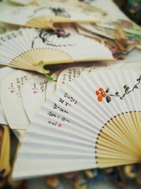 Close-up of folding fans on table