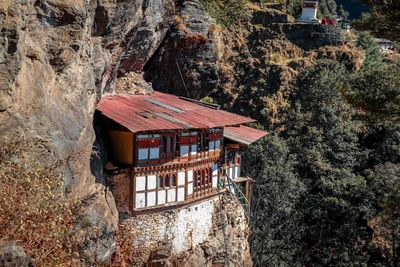 House amidst trees and buildings