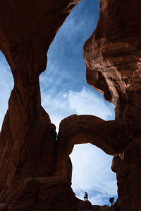 Low angle view of rock formation against sky