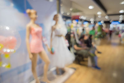 Blurred motion of people at store