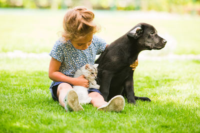 Woman with dog on field