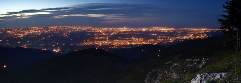 High angle view of illuminated buildings in city at night