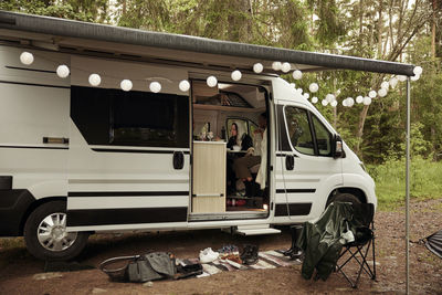 Camper van parked in forest