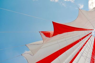 Low angle view of flag against blue sky