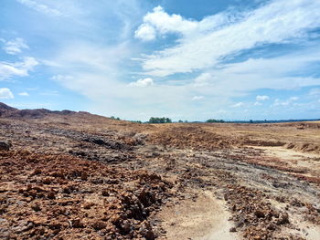 Scenic view of barren landscape against sky