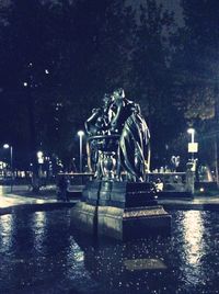 Illuminated fountain at night