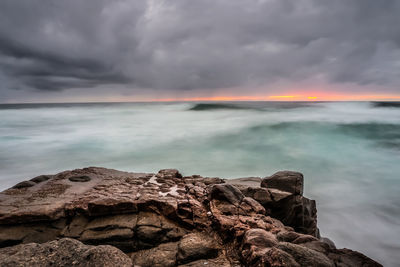 Scenic view of sea against cloudy sky