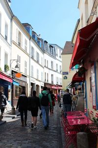 People walking on multi colored city