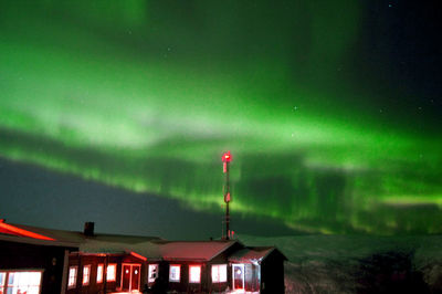 Low angle view of illuminated building against sky at night