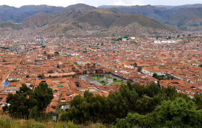 High angle view of townscape and mountains