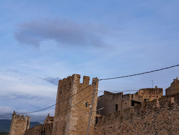 Low angle view of fort against blue sky