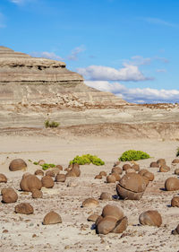 Rocks on land against sky