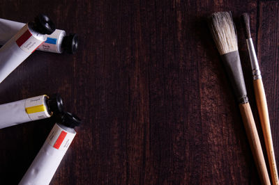 High angle view of paintbrushes on table