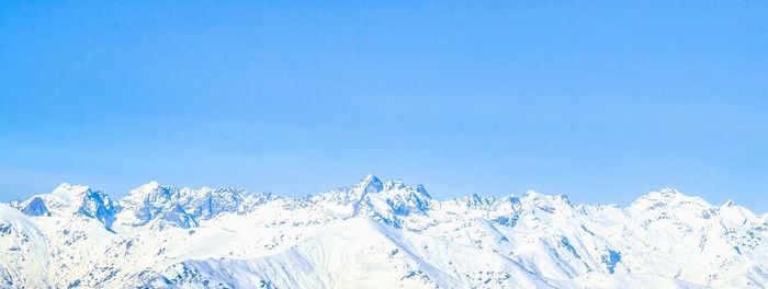 Scenic view of snow covered mountains