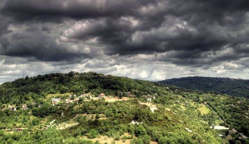 Scenic view of landscape against cloudy sky