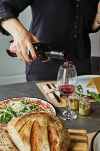 Midsection of man preparing food on table