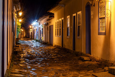 View of historic colonial style street at night in paraty city