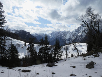 Scenic view of snow covered mountains against sky