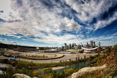 Panoramic view of buildings and city against sky