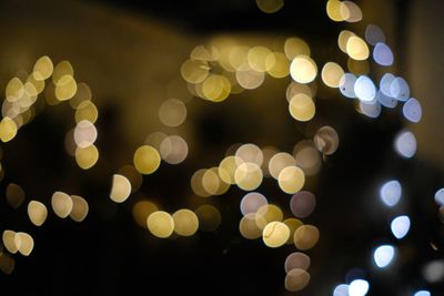 Defocused image of illuminated lights at night