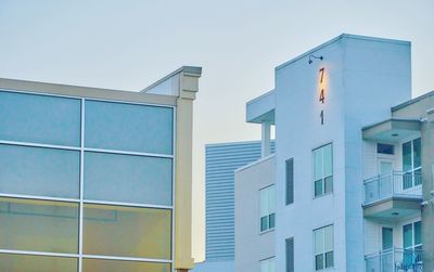 Low angle view of modern buildings against clear sky