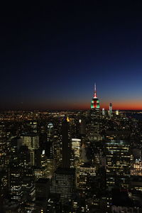 Illuminated buildings in city at night