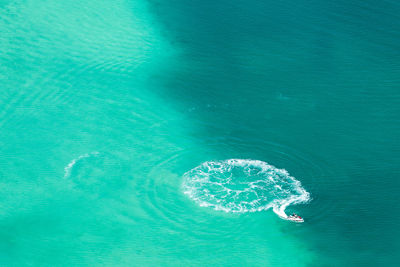 Aerial view of boat moving on sea