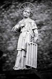 Low angle view of statue against trees