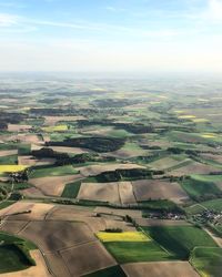 Aerial view of agricultural field against sky