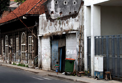 Graffiti on old building in city