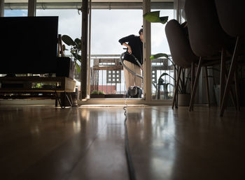 Man sitting on chair at home