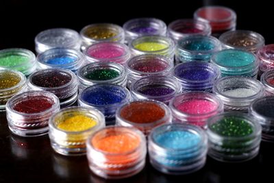 High angle view of colorful glitters on table