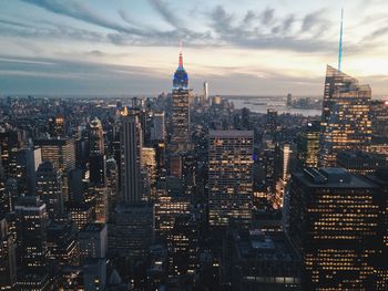 High angle view of city lit up at dusk