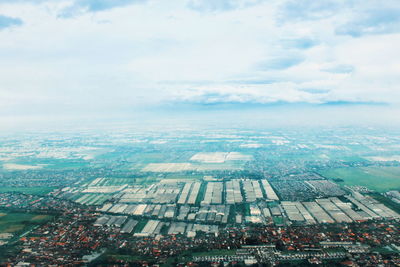 High angle view of buildings in city against sky