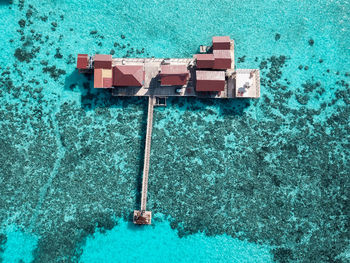 High angle view of blue sea against wall