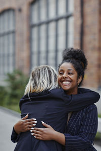 Female friends hugging