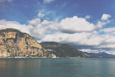 Scenic view of mountains against cloudy sky