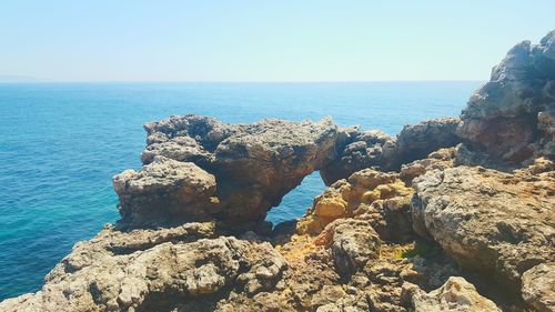 Scenic view of sea against blue sky