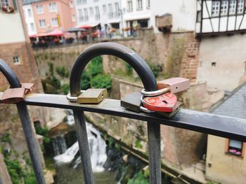 Close-up of padlocks on railing