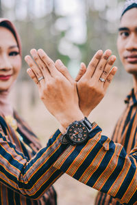 Close-up of woman holding hands