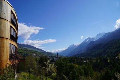 Scenic view of mountains against blue sky