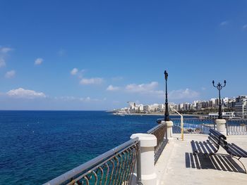 Scenic view of sea against blue sky