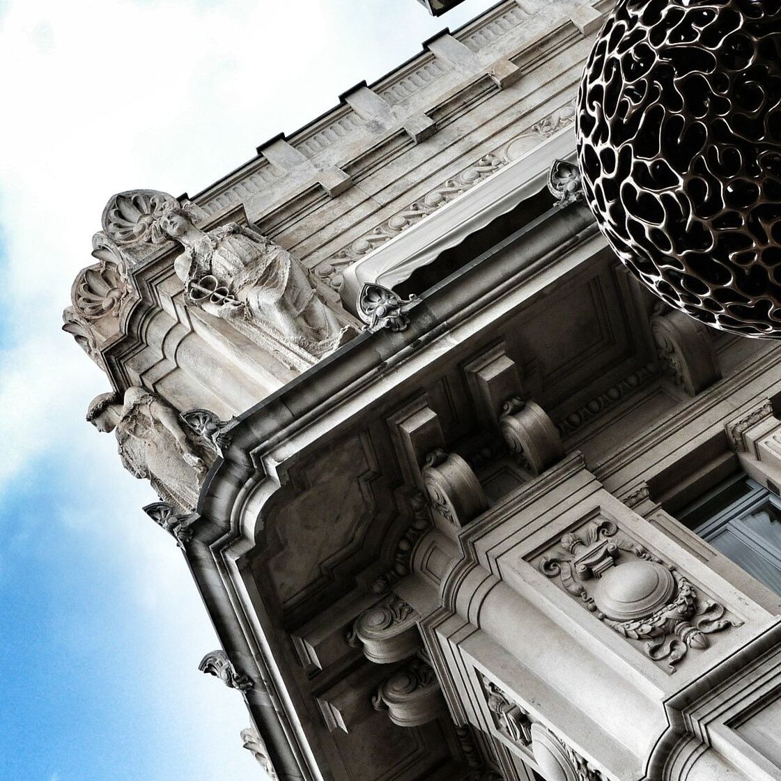 low angle view, architecture, built structure, building exterior, history, religion, place of worship, spirituality, sky, art and craft, ornate, art, carving - craft product, architectural column, famous place, old, temple - building, travel destinations, creativity, sculpture