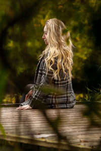 Side view of woman wearing hat outdoors