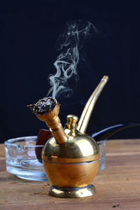 Close-up of cigarette on table